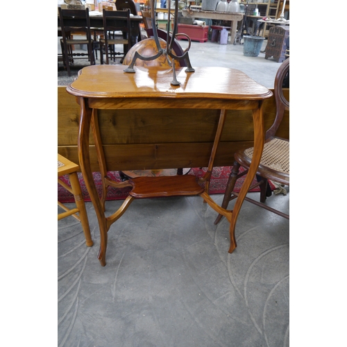 2133 - An oak two tier side table and a cane seated bedroom chair