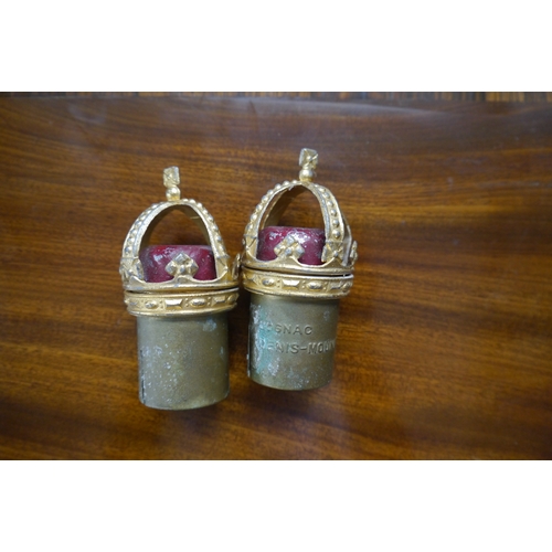 2156A - A pair of cognac bottle stops with crowns