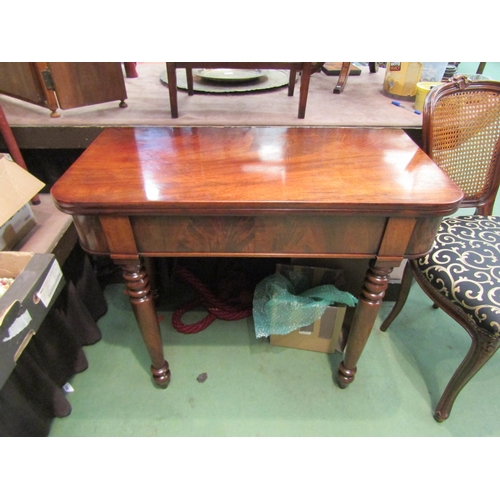 4003 - A Circa 1850 flame mahogany tea/side table the fold-over swivel top on turned and tapering legs, mis... 