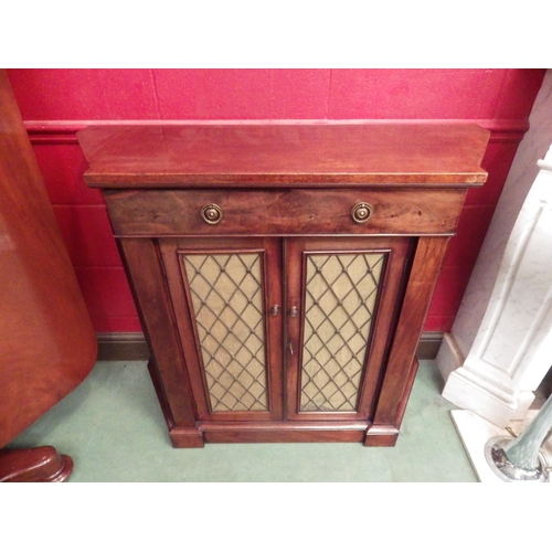 4046 - A Regency flame mahogany side cabinet with canted sides, the single drawer over two lattice brass, c... 