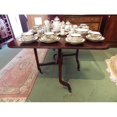 4070 - A George III style mahogany Sutherland table, the rising leaves over shaped legs and brass cup casto... 