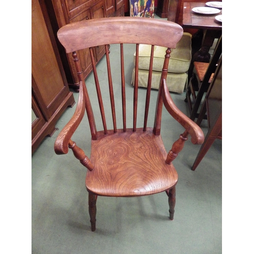 4115 - A circa 1860 elm and ash stick-back Windsor armchair (stamped C.M.) on ring-turned supports and legs... 