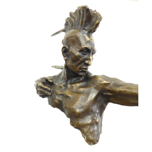 7129 - A sculptural bronze of an American Indian holding a bow. Set on a slate plinth base. 84cm high