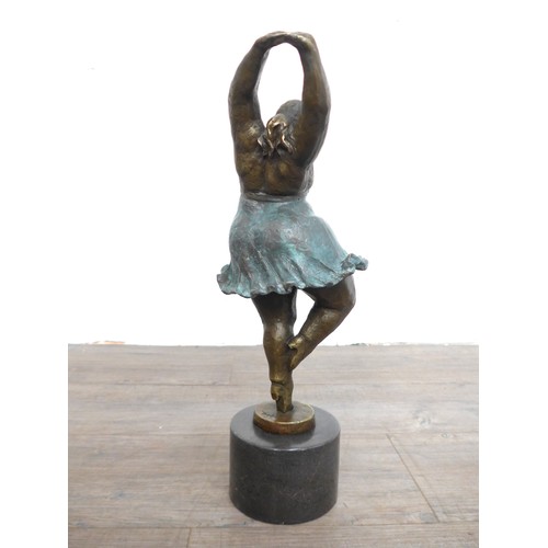 7128 - A bronze figure of a ballerina after Botero. Set on a marble plinth. 45cm high