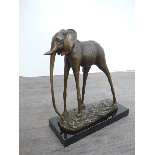 7130 - An abstract bronze figure of an Elephant after Dali. Set on a marble plinth base. 34cm high