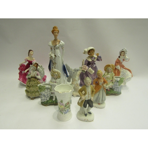 4466 - A collection of porcelain figures including bone china bird on branch, female figure with posie vase... 