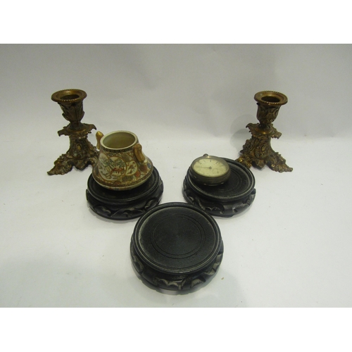 4468 - A pair of cast metal candlesticks, three Oriental wooden stands, satsuma pot and a silver pocket wat... 