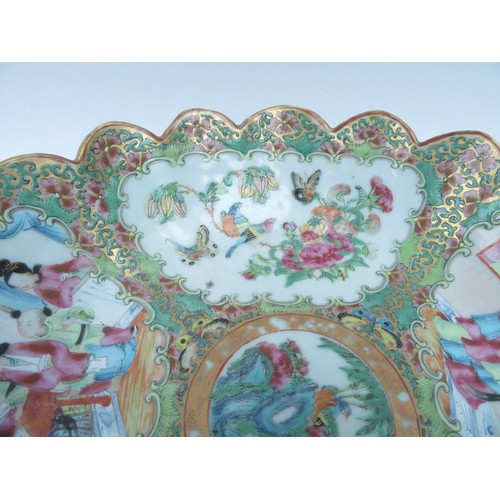 6261 - A late 19th Century Cantonese scalloped bowl on stand.  The interior decorated with birds, butterfli... 