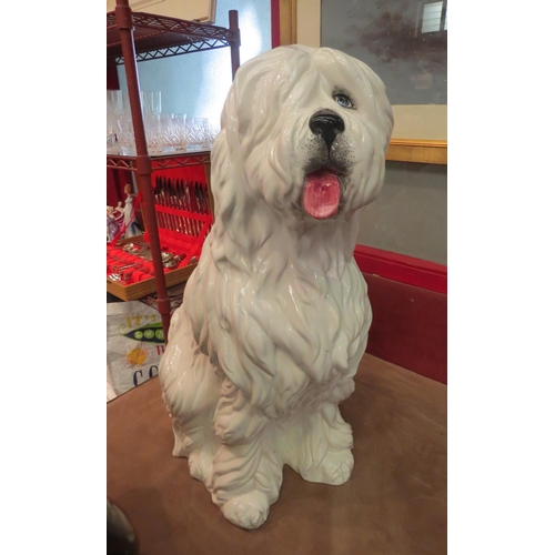 4010 - A floorstanding ceramic figure of an Old English Sheepdog, standing approximately 73cm high