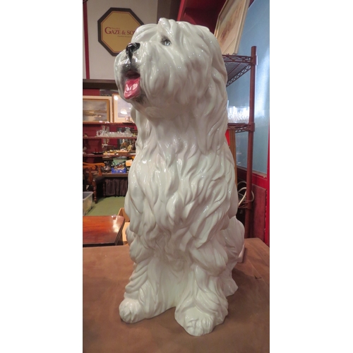 4010 - A floorstanding ceramic figure of an Old English Sheepdog, standing approximately 73cm high