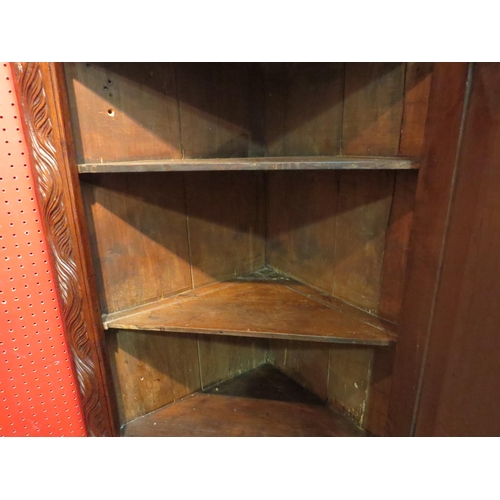 4060 - A 17th Century revival carved oak single door corner cupboard, 88cm tall x 70cm wide x 35cm deep