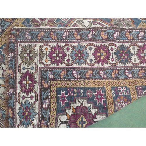 4081 - A Caucasian Shirvan rug, hand knotted, natural dyes, multiple borders, worn, 150cm x 110cm