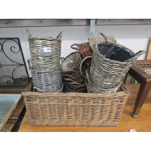 2086 - A Quantity of wicker baskets and planters