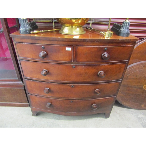 2100 - A Victorian mahogany bow-front chest of two over three drawers