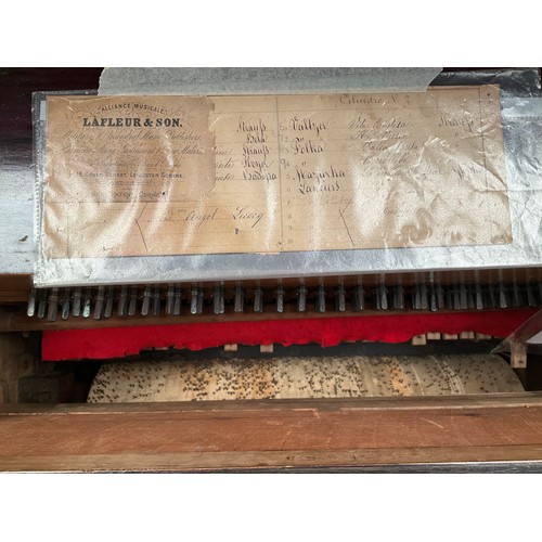 9003 - A Lafleur and Son half-size hand-wound barrel piano, black lacquered wooden case with mirrored panel... 