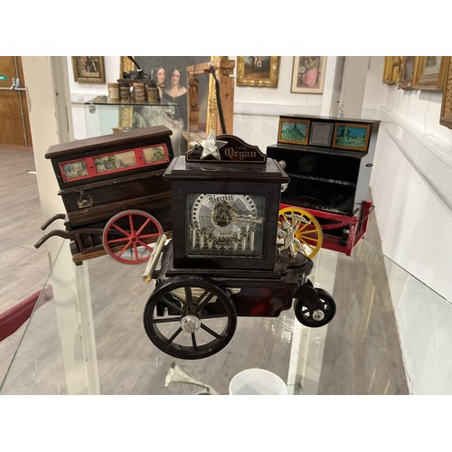 9020 - Three miniature street piano form music boxes.

Colin Williams Collection