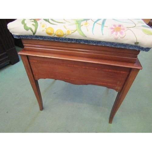 4063 - An Edwardian crossbanded mahogany piano stool with end push button rising seat, having exotic bird e... 