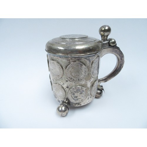 6378 - A Danish/Scandinavian silver peg tankard inset with coins from the 17th Century.  The top set with C... 