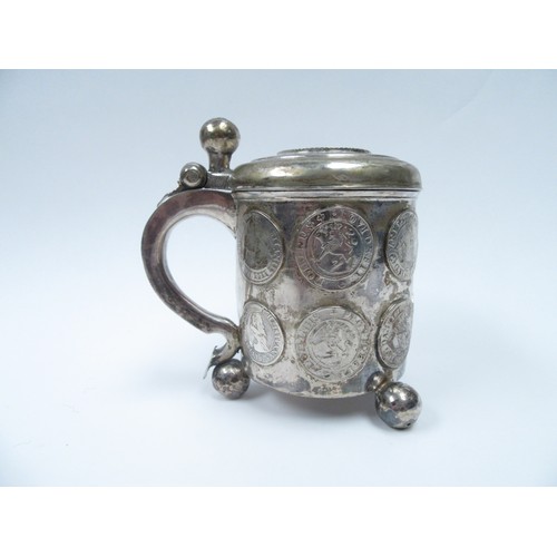 6378 - A Danish/Scandinavian silver peg tankard inset with coins from the 17th Century.  The top set with C... 