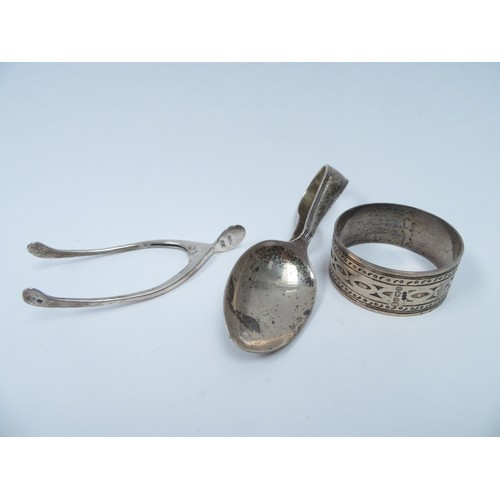 6360 - A pair of Levi & Salaman wishbone sugar nips, silver feeding spoon and napkin ring, 64g