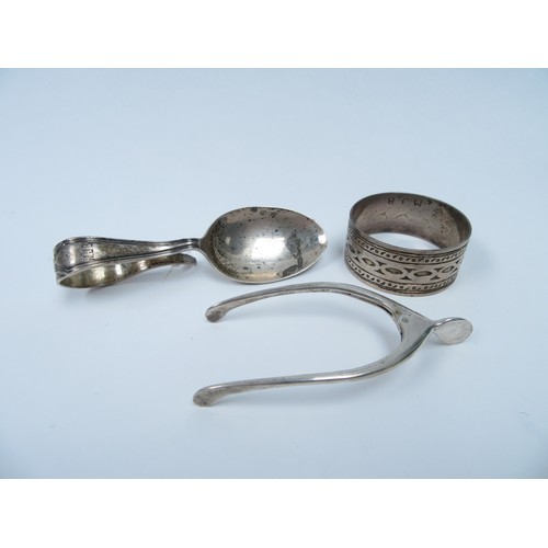 6360 - A pair of Levi & Salaman wishbone sugar nips, silver feeding spoon and napkin ring, 64g