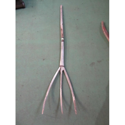 8030 - A wooden three tine hay fork and pair of wooden hames