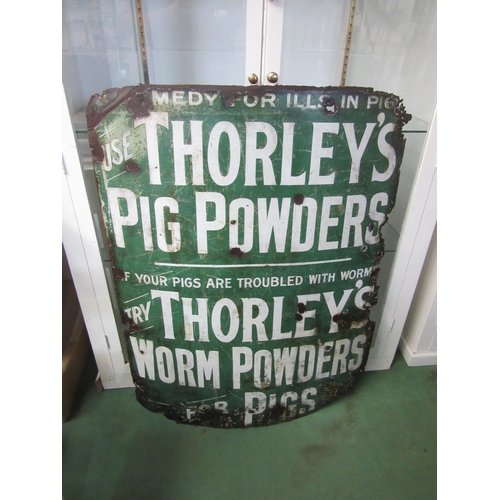 8083 - An enamel sign; Thorleys Pig Powders, edges a/f, 92 x 117cm approx