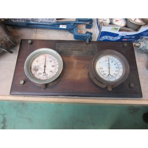 8118 - A Haslam Engine Co board with two pressure gauges