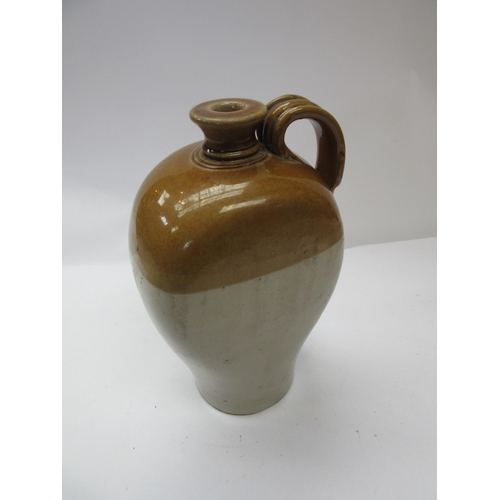 8134 - A shaped single handled glazed flagon