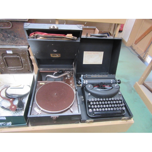 8170 - A cased Remington typewriter and cased HMV gramophone