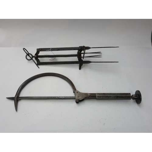 8215 - A thatchers needle and a guillotine type mole trap