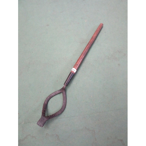 8283 - A serrated elliptical weeder, marked FB