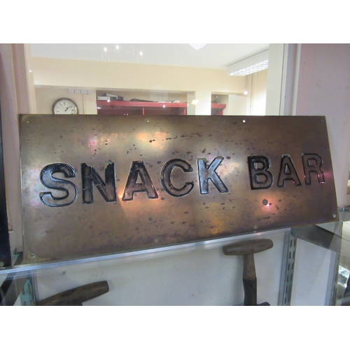 8367 - A large brass 'Snack Bar' sign, 64 x 24cm