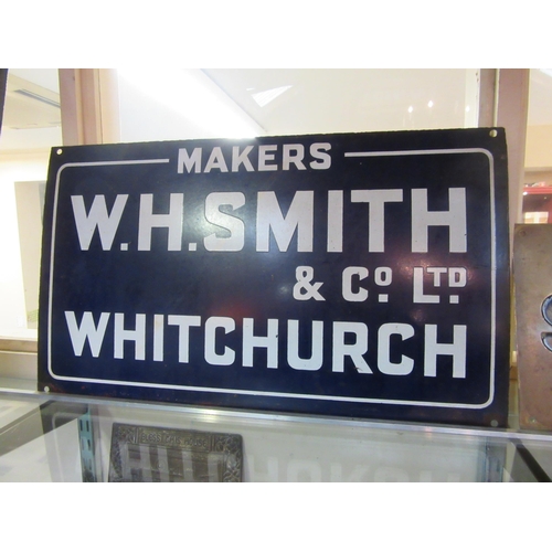 8368 - An enamel sign; W H Smiths, 61 x 35cm