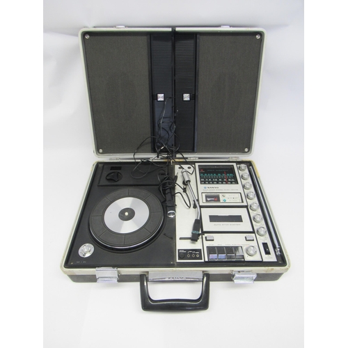 7375 - A 1970s Sanyo G-2311KL Solid State Music Centre portable record player with speaker lid