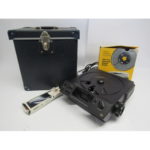 7442 - A Kodak Ektalite 2000 slide projector in fitted case with boxed S-AV 2000 carousel and Hama laserpoi... 