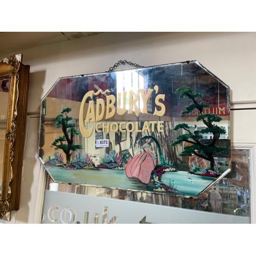 8373 - A Deco wall hanging mirror with later painted image of maiden and Cadburys lettering to glass