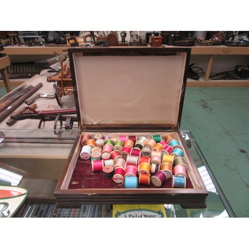 8388 - A Dewhursts Cotton box with lift up lid, containing a quantity of mixed cotton reels, mixed colours