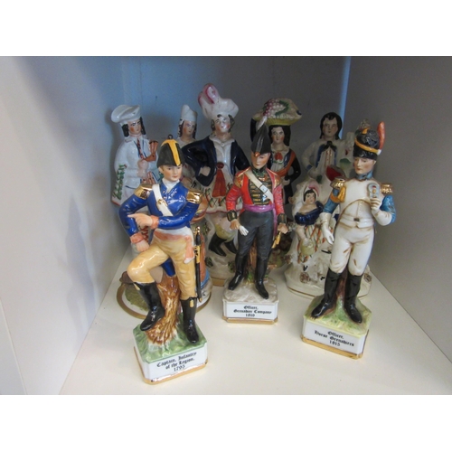 1499 - Nine assorted figures and figural groups including Staffordshire, three soldiers and Capodimonte sea... 