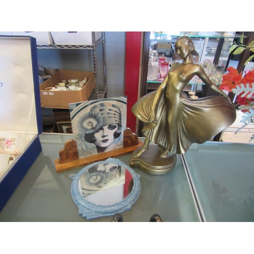 1599 - A 1930's gilt plaster dancing lady, a blue bakelite wall mirror and a wooden sunburst Art Deco photo... 