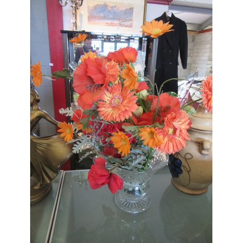 1602 - A crystal glass vase, 20cm tall, with faux flower contents