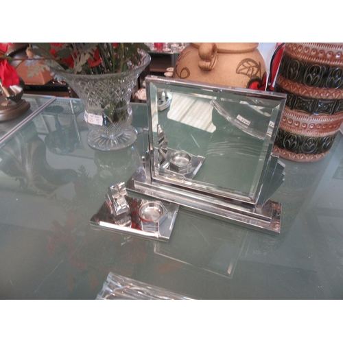 1604 - An Art Deco chromed Scottie dog desk paperweight and a chrome Art Deco easel mirror