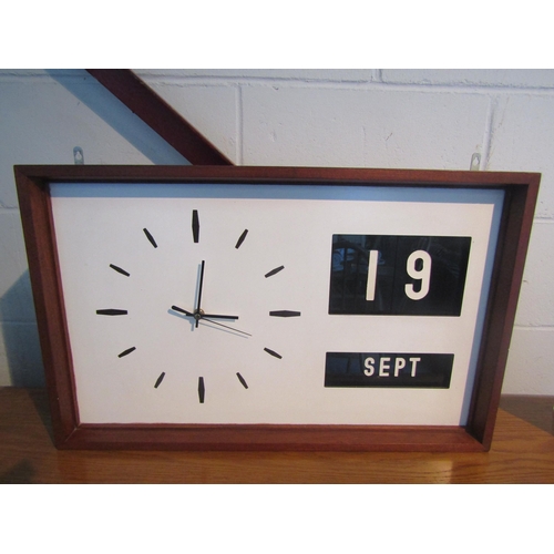 1009 - A teak framed wall mounted battery operated clock (replacement mechanism) with manual perpetual cale... 