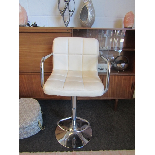 1017 - A chrome base leatherette bar stool