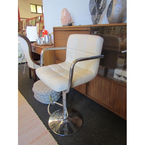 1017 - A chrome base leatherette bar stool