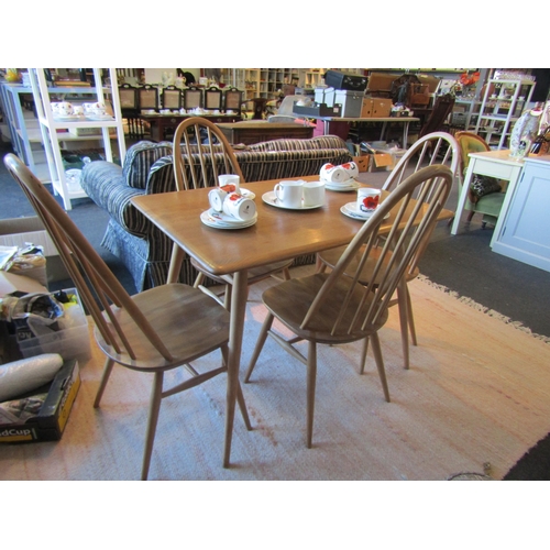 1031 - An Ercol breakfast table with undershelf and four Quaker chairs.  Table 99cm long, 69cm deep, 74cm h... 