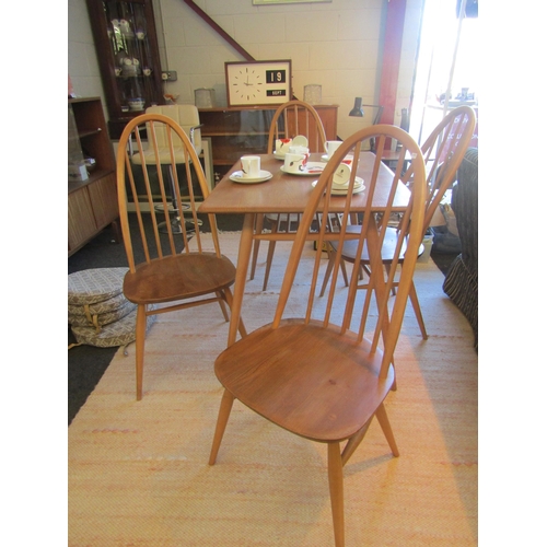 1031 - An Ercol breakfast table with undershelf and four Quaker chairs.  Table 99cm long, 69cm deep, 74cm h... 