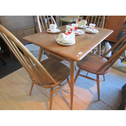 1031 - An Ercol breakfast table with undershelf and four Quaker chairs.  Table 99cm long, 69cm deep, 74cm h... 