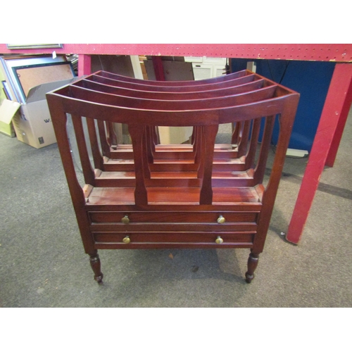 1041 - A Canterbury magazine rack with two drawers on turned feet, 54cm tall x 47cm wide x 37.5cm deep