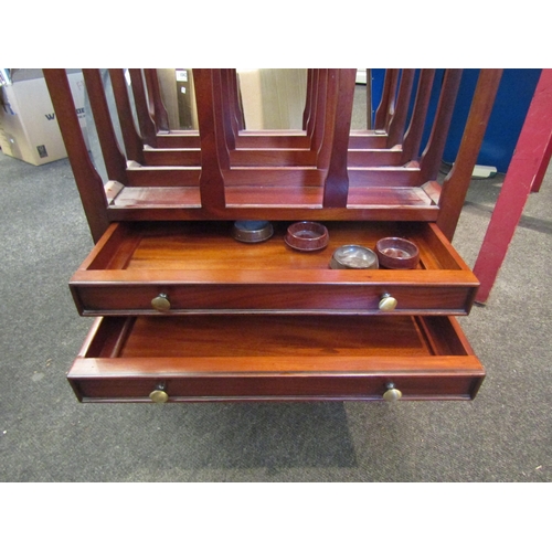 1041 - A Canterbury magazine rack with two drawers on turned feet, 54cm tall x 47cm wide x 37.5cm deep